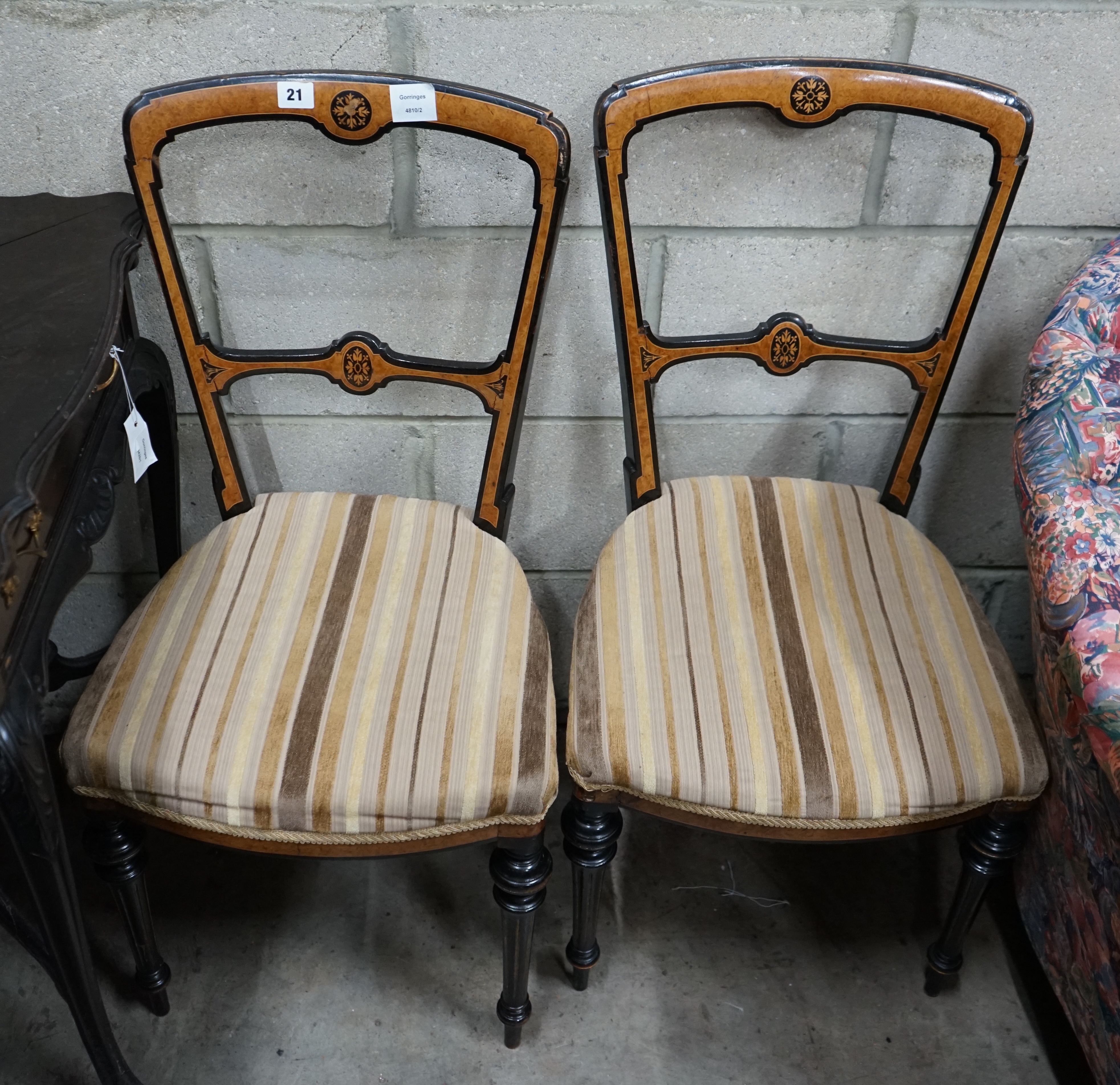 A pair of Aesthetic movement dining chairs